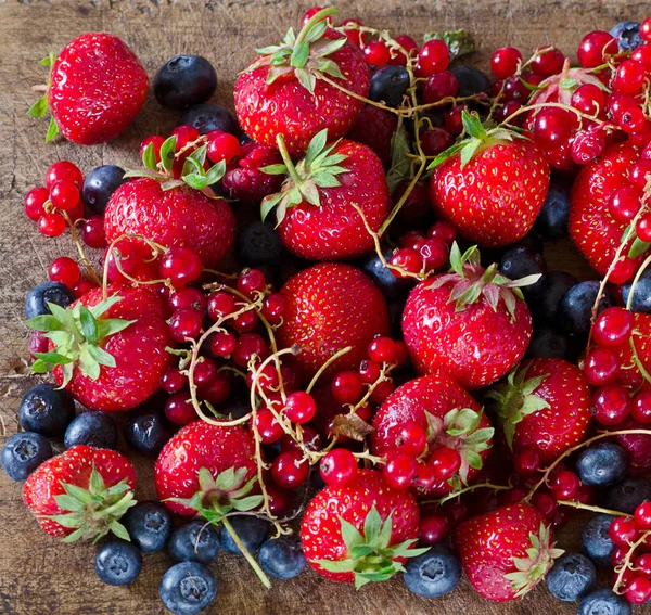 Mix of fresh berries on board. — Stock Photo, Image