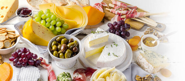 tasty antipasto on wooden background