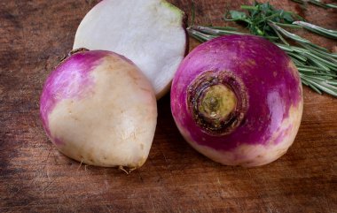 Fresh turnips on rustic wooden board. clipart