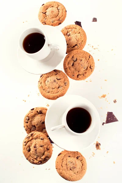 Cup of coffee with flying cookies