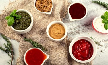 Different sauces in bowls  clipart