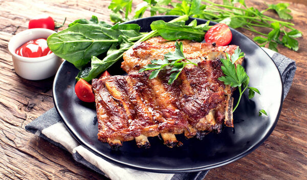 Barbecue spare ribs on an rustic wooden table