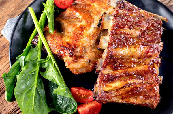 Barbecue spare ribs on an rustic wooden table