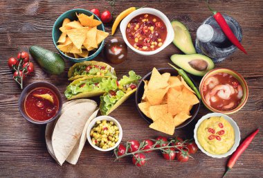 Mexican traditional food on wooden background. Top view clipart