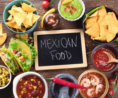 Mexican traditional food on wooden background. Top view clipart