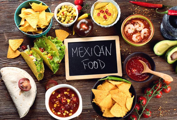 Mexican traditional food on wooden background. Top view