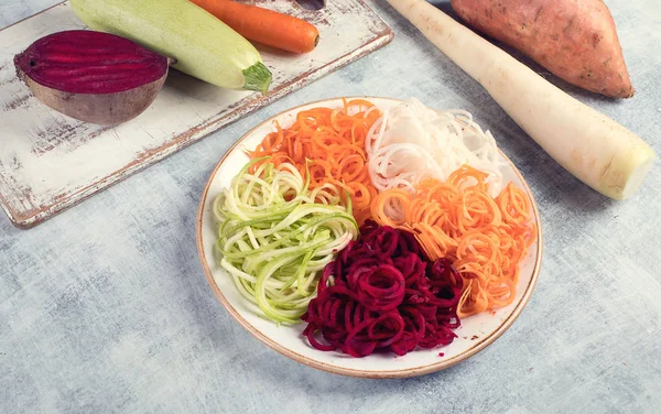 Vegetable noodles. Fresh zucchini, carrot, white radish, sweet potato  and beet root pasta