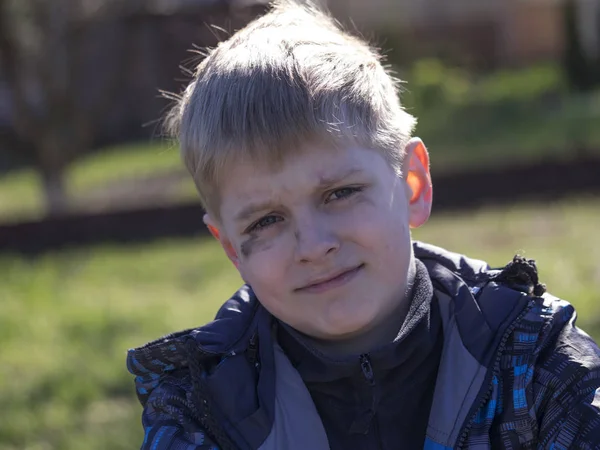 Boy smeared with soot — Stock Photo, Image