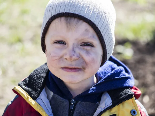 Boy smeared with soot — Stock Photo, Image