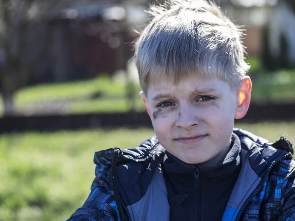 Boy smeared with soot — Stock Photo, Image