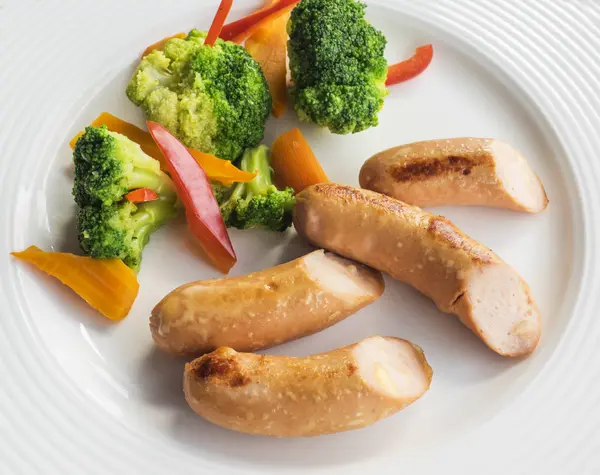 Sausages with vegetables — Stock Photo, Image