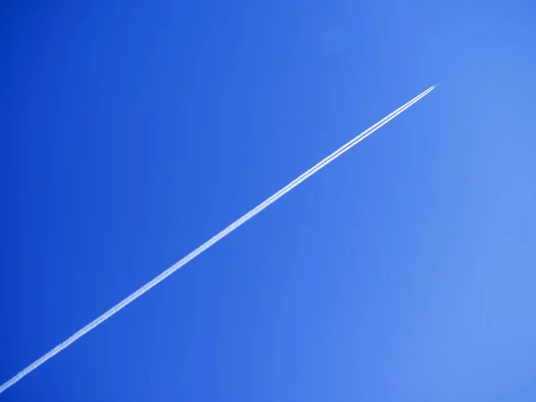 Airplane with traces — Stock Photo, Image