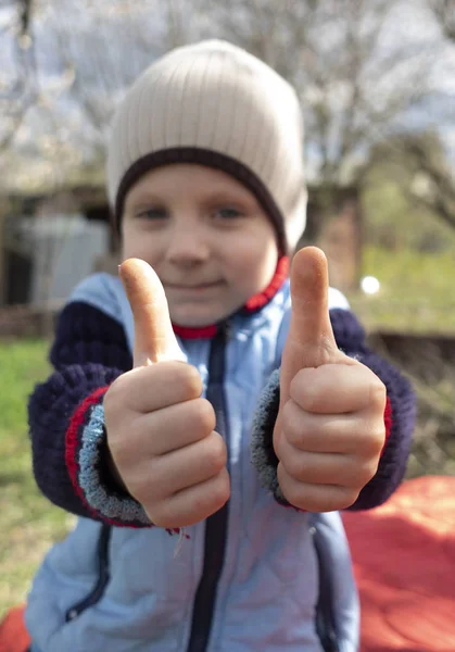 Little Caucasian Boy Holding Two Thumbs Selective Focus — Stock Photo, Image