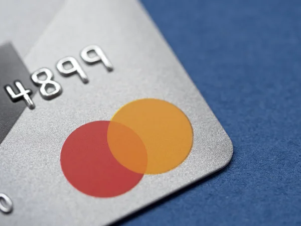 Mastercard bank card on a dark blue background — Stock Photo, Image