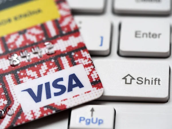 Bank card Visa on computer keyboard — 스톡 사진