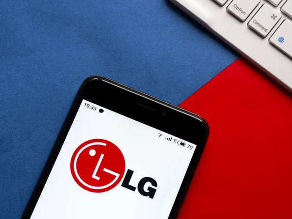 In this photo illustration the LG logo is seen displayed on a sm — 스톡 사진