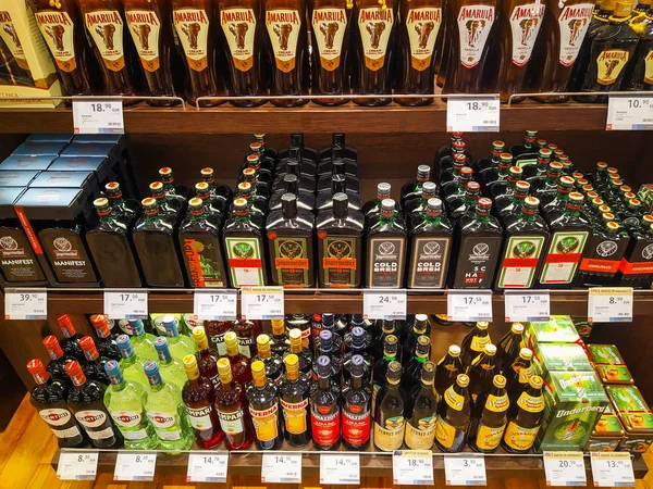 A lot of bottles of various alcohol brands (liquors, tinctures, — 스톡 사진