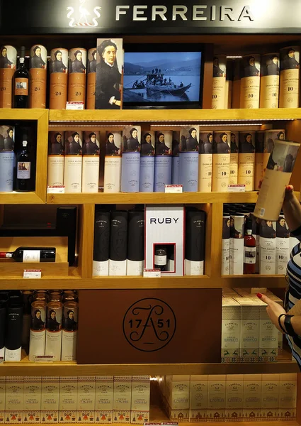 A lot of bottles of Porto Ferreira Distillery at the Duty Free S — Stock Photo, Image