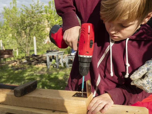 Caucasian Boy Assembly Wooden Frame Building Using Metal Fasteners Using — Stock Photo, Image