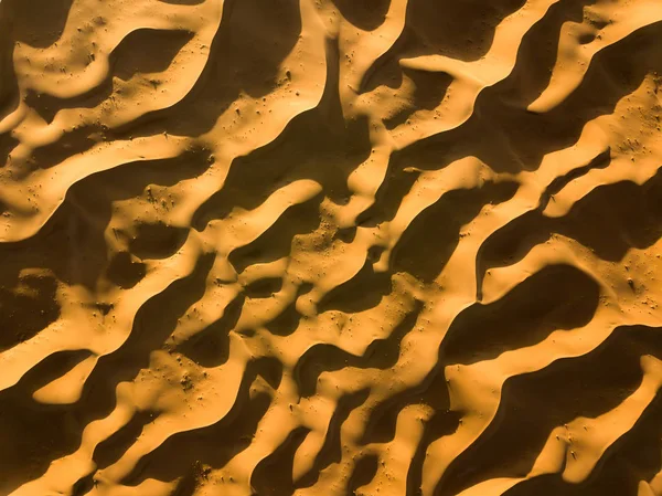 Aerial top view on sand dunes in desert — Stock Photo, Image