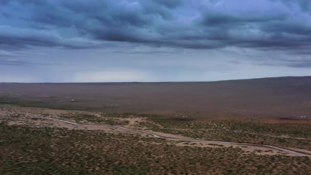 Sand dunes with storm clouds at sunset in desert — Stock Video