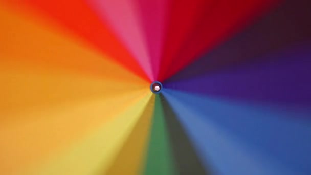 Multi Colored Rainbow Umbrella Rotates Its Axis — Stock Video