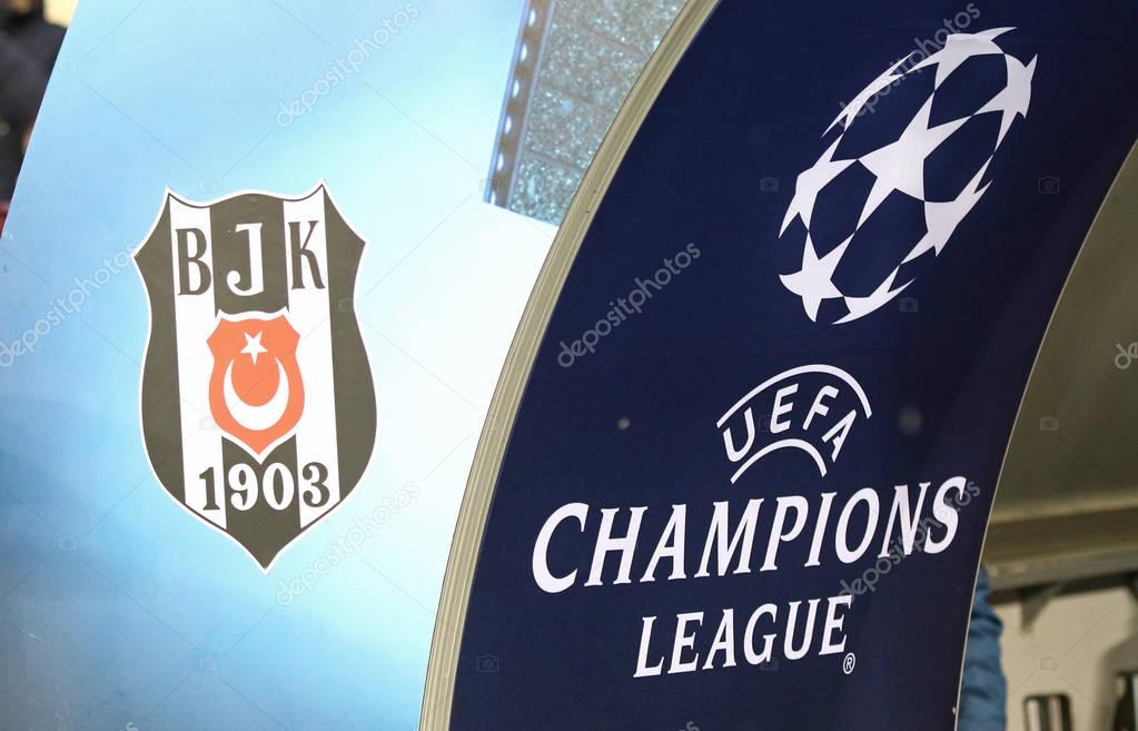 KYIV, UKRAINE - DECEMBER 6, 2016: UEFA Champions League logo and Besiktas club emblem on the stand during UEFA Champions League game FC Dynamo Kyiv vs Besiktas at NSC Olimpiyskyi stadium in Kyiv