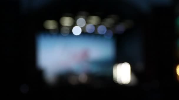Bokeh desfocado fundo de iluminação concerto no palco — Vídeo de Stock