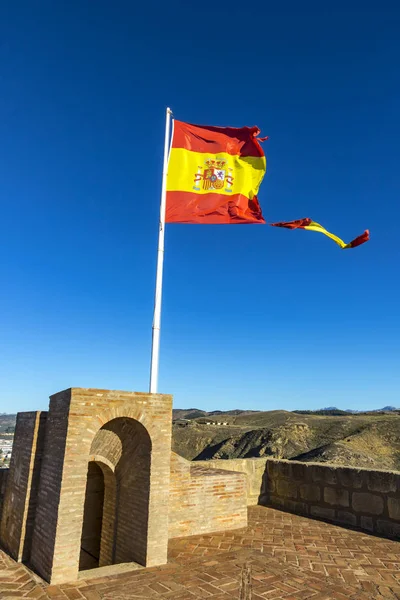 Torn Spanish flag waving on the wind — Stock Photo, Image