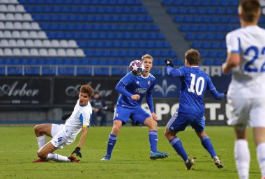 Kyiv, Ukraine - February 12, 2020: FC Dynamo Kyiv U19 (in White) and Dinamo Zagreb U19 (in Black) players fight for a ball during their UEFA Youth League game at Lobanovskiy stadium in Kyiv