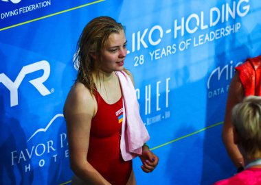 KYIV, UKRAINE - AUGUST 6, 2019: Sofiia LYSKUN of Ukraine celebrates the golden medal in Womens 10m Platform Final of the 2019 European Diving Championship in Kyiv, Ukraine