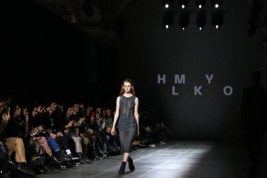 Kyiv, Ukraine - February 5, 2020: Model presents a collection of clothes by designer HMYLKO during the 46th Ukrainian Fashion Week season Fall/Winter 2020/21 at Mystetskyi Arsenal in Kyiv