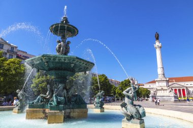 Lisbon, Portugal - September 23, 2015: Mermaid Statues in baroque fountain on Rossio square (Pedro IV Square) in center of Lisbon city, Portugal. Bronze sculptures were installed in 1889