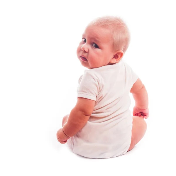 Baby looks over his shoulder — Stock Photo, Image