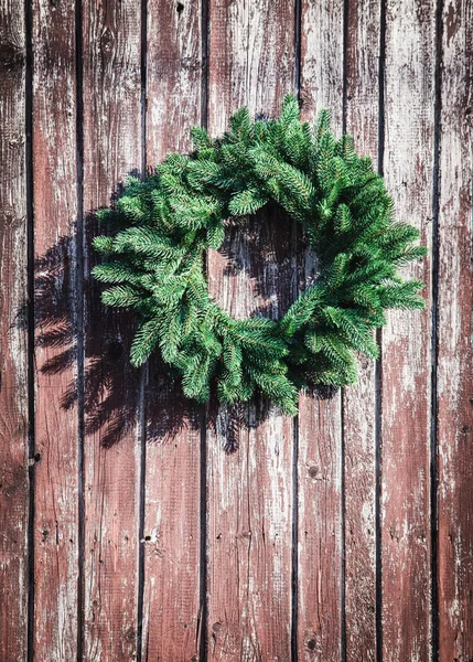 Christmas wreath on the wall — Stock Photo, Image