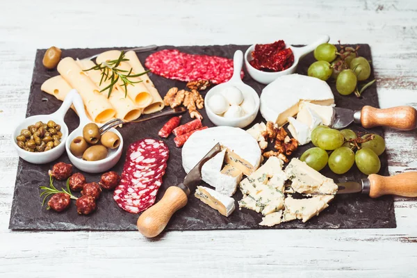 Cheese and salami plate — Stock Photo, Image