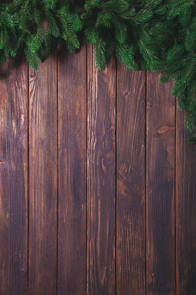 Wooden background with fir-tree — Stock Photo, Image