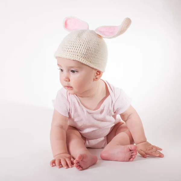 Baby girl in a rabbit hat — Stock Photo, Image