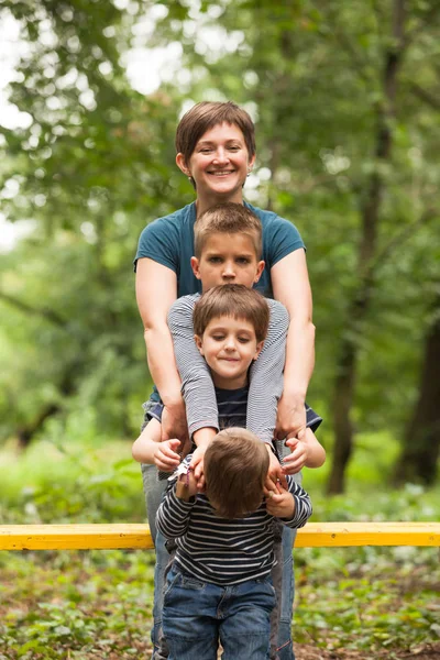Mother with sons outdoors — Stock Photo, Image