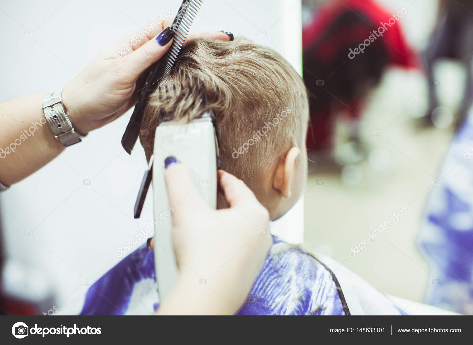 Little boy makes hairstyle at the hairdresser Stock Photo by ©oksixx  148633101