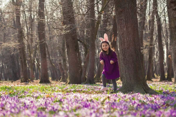 Little girl with banny ears in spring park — Stock Photo, Image