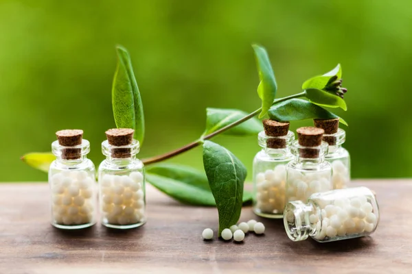 Homeopathy pills in vintage bottles — Stock Photo, Image