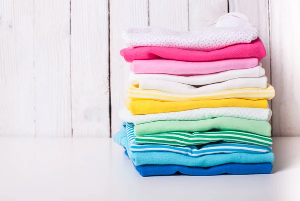 Folded baby clothes — Stock Photo, Image