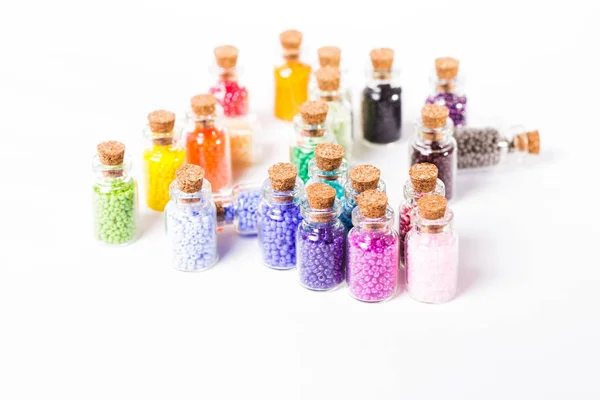 Colorful beads in the bottles — Stock Photo, Image