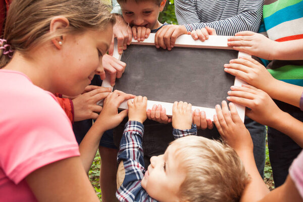 Hands holding advert board