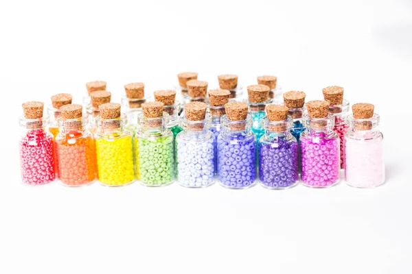 Colorful beads in the bottles — Stock Photo, Image