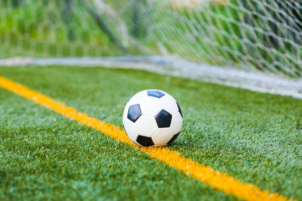 Soccer ball on artificial grass