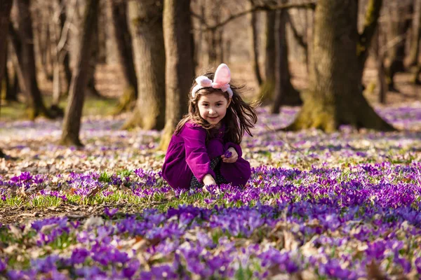 Little girl with banny ears in spring park — Stock Photo, Image