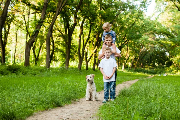 Kids with fox terrier dog — Stock Photo, Image