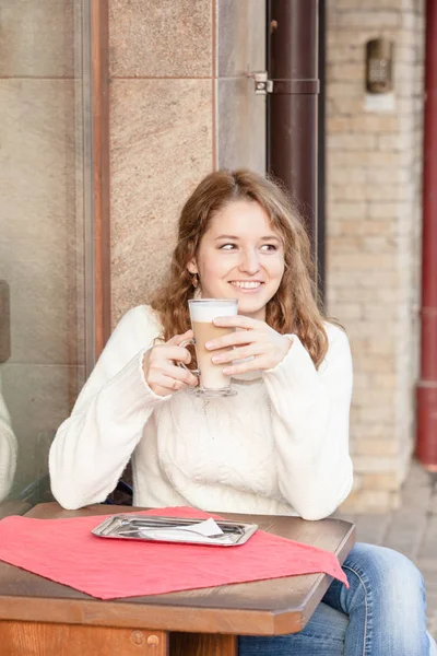 Latte in the hand — Stock Photo, Image